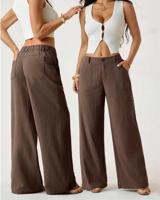 Pantalones con cintura elástica, bolsillo y pernera ancha de estilo casual.