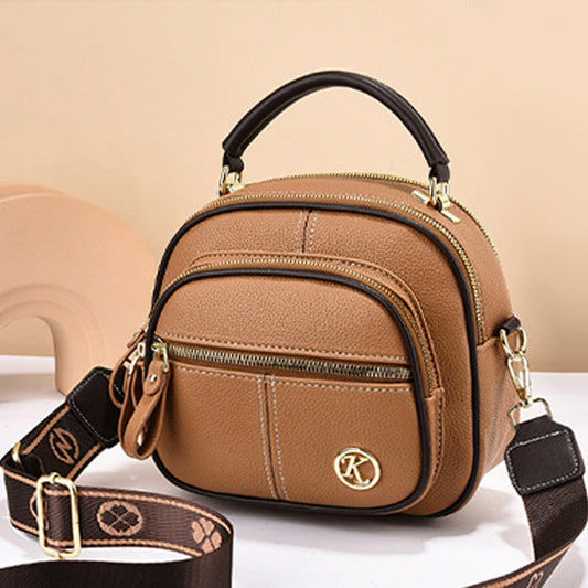 ⏰👜✨ Bolso bandolera clásico de piel sintética: versátil, correa ancha ajustable y múltiples compartimentos.