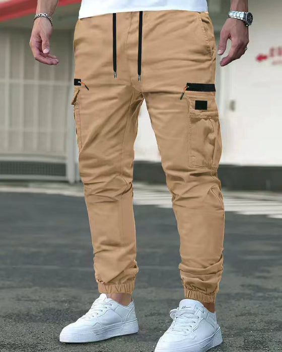 Pantalones de hombre con puños elásticos, color liso, corte relajado.