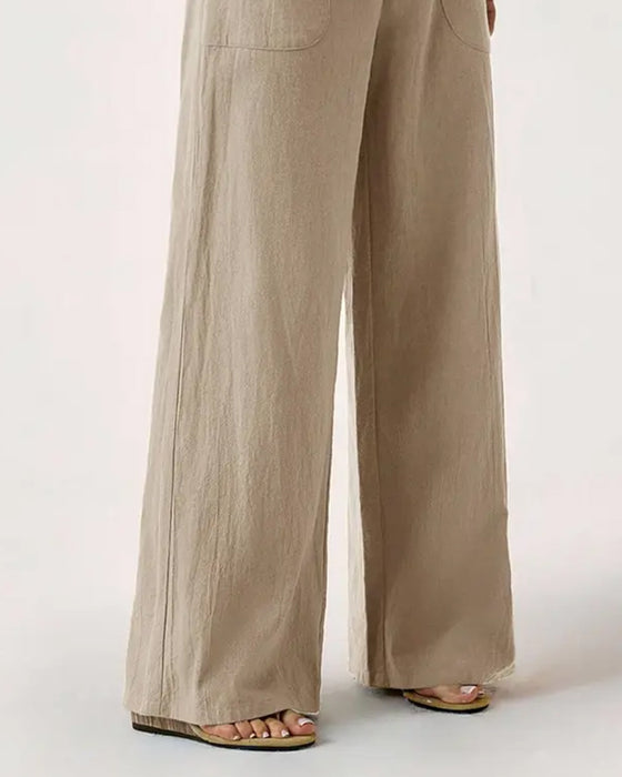Pantalones con cintura elástica, bolsillo y pernera ancha de estilo casual.