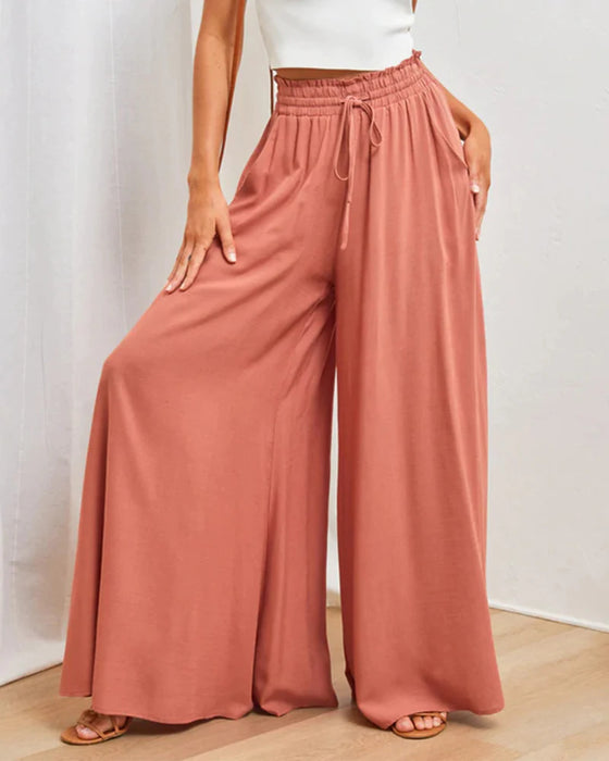 Pantalones lisos de pierna ancha y cintura alta.