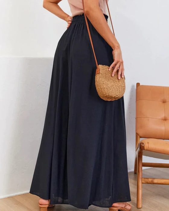 Pantalones lisos de pierna ancha y cintura alta.