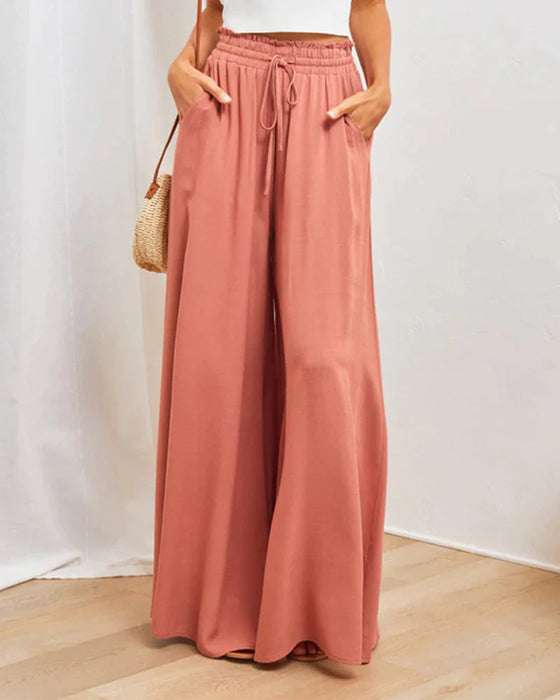 Pantalones lisos de pierna ancha y cintura alta.