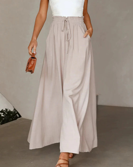 Pantalones lisos de pierna ancha y cintura alta.