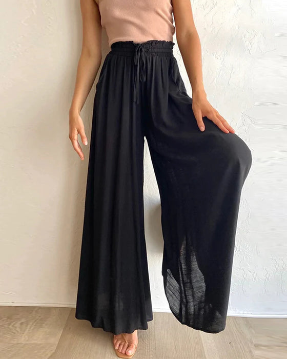 Pantalones lisos de pierna ancha y cintura alta.