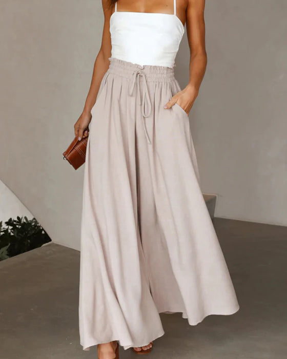 Pantalones lisos de pierna ancha y cintura alta.
