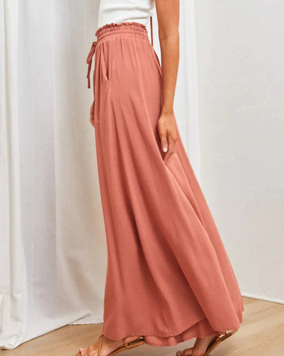 Pantalones lisos de pierna ancha y cintura alta.
