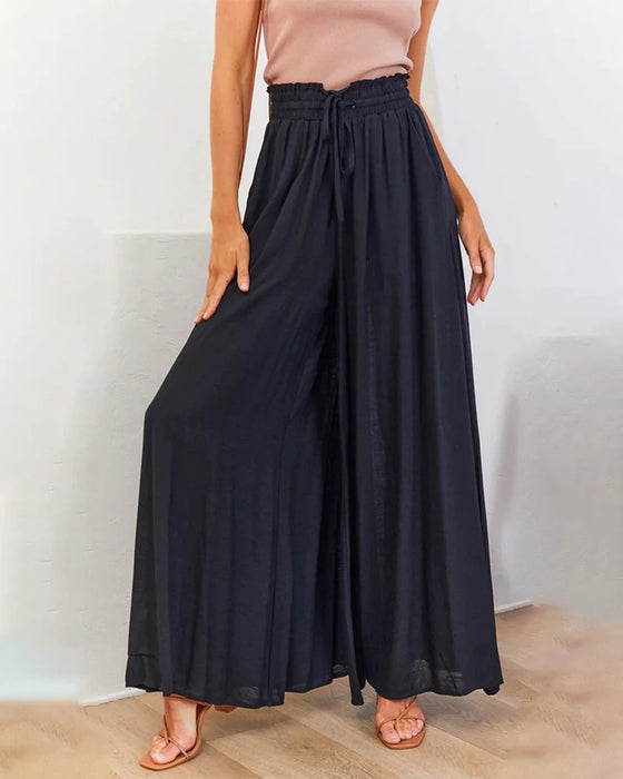 Pantalones lisos de pierna ancha y cintura alta.
