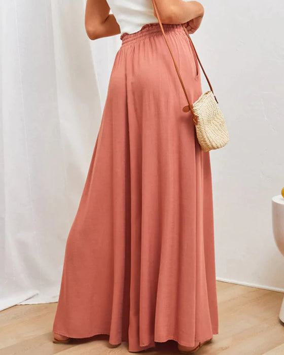 Pantalones lisos de pierna ancha y cintura alta.