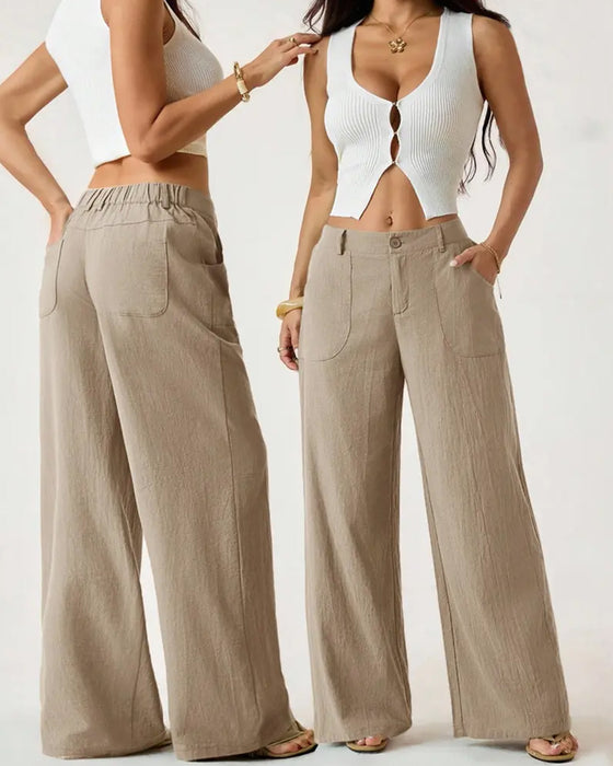 Pantalones con cintura elástica, bolsillo y pernera ancha de estilo casual.