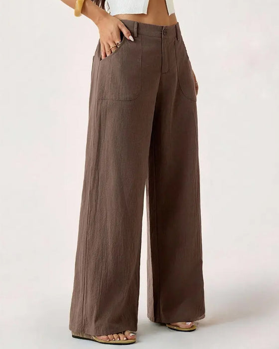 Pantalones con cintura elástica, bolsillo y pernera ancha de estilo casual.