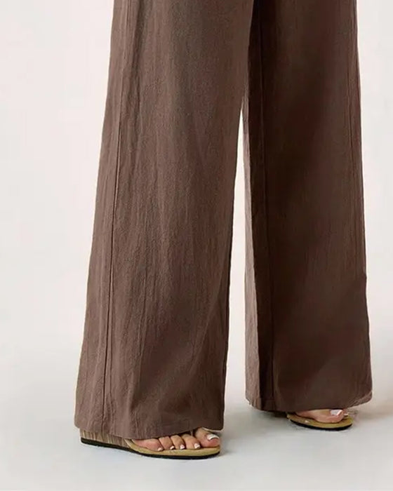 Pantalones con cintura elástica, bolsillo y pernera ancha de estilo casual.