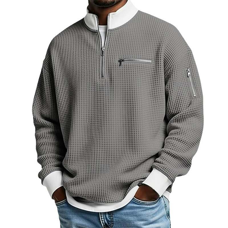 Suéter de punto gofrado para hombre con cremallera hasta el cuello.