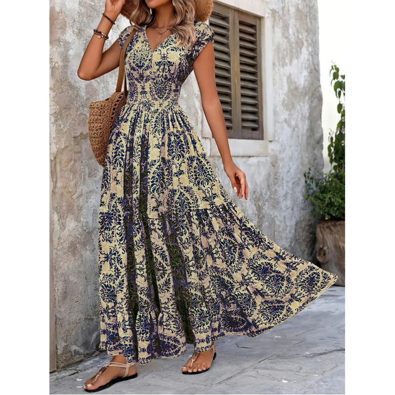 Vestido largo de mujer con escote en V, estampado floral y cintura fruncida.